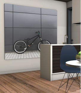 bicicleta apoyada en pared gris